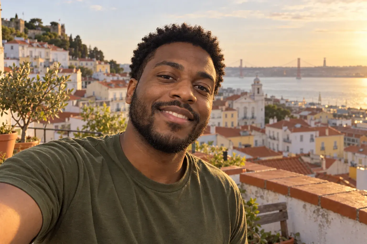 Smiling man on a Lisbon rooftop at golden hour