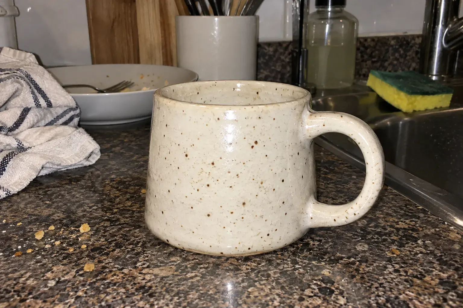 Mug on a cluttered kitchen counter