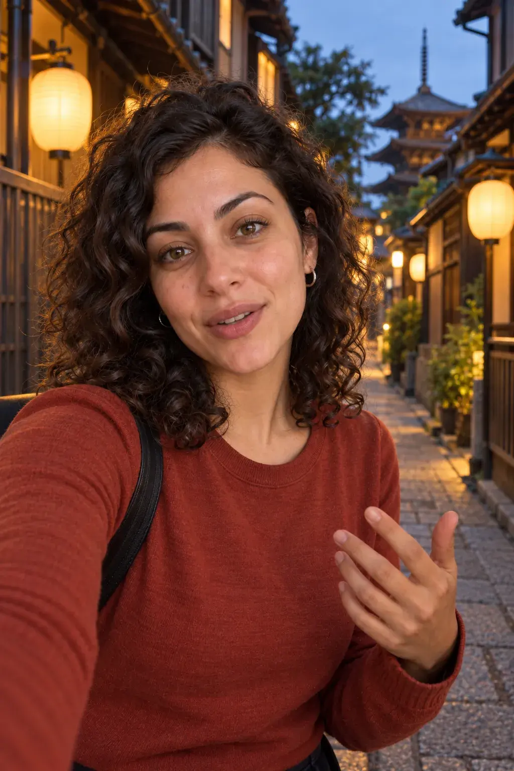 Woman talking to camera on a lantern lit Kyoto street