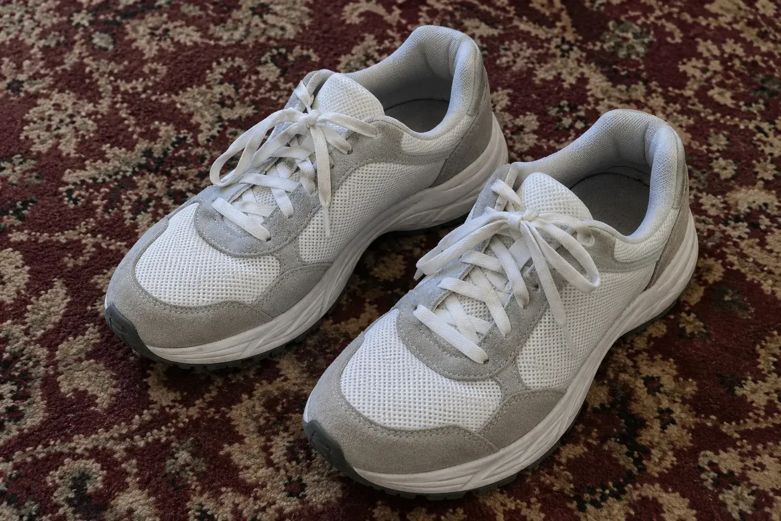 Sneakers photographed on a carpet